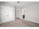 Bedroom featuring carpeted floors, a double door closet, with a bathroom through the door at 319 Riverton Way, Woodstock, GA 30188