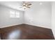 Bright and spacious bedroom featuring hardwood floors and ample natural light at 319 Riverton Way, Woodstock, GA 30188