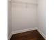 A walk-in closet with wood flooring and a wire rack for extra storage space at 319 Riverton Way, Woodstock, GA 30188