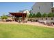 Community fire pit and outdoor seating area, perfect for relaxing with friends and Gathering on cool evenings at 319 Riverton Way, Woodstock, GA 30188