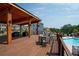 Relaxing outdoor deck overlooking a pool, perfect for entertaining with ample seating and scenic views at 319 Riverton Way, Woodstock, GA 30188
