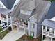Charming two-story home with a double porch, neutral siding, and manicured landscaping at 319 Riverton Way, Woodstock, GA 30188