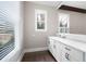 Well-lit flex room with a long countertop, cabinets, and a large window with blinds at 319 Riverton Way, Woodstock, GA 30188