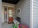 Inviting front porch with a comfortable bench and potted plants, creating a welcoming atmosphere at 319 Riverton Way, Woodstock, GA 30188
