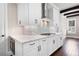 Modern kitchen featuring quartz countertops and stainless steel appliances and custom cabinetry at 319 Riverton Way, Woodstock, GA 30188