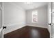 Bright room perfect for an office or study, featuring wood floors and a window at 319 Riverton Way, Woodstock, GA 30188