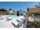 Relaxing community pool area with ample lounge chairs and umbrellas for sunny days at 319 Riverton Way, Woodstock, GA 30188