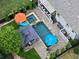 Aerial view of a backyard oasis featuring a pool, spa, gazebo, patio, and meticulous landscaping at 319 Riverton Way, Woodstock, GA 30188