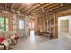 Unfinished basement featuring exposed beams and ductwork, offering potential for customization at 4710 Mcintosh Dr, Cumming, GA 30040