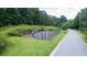 A fenced basketball court provides recreational opportunities within the community at 4710 Mcintosh Dr, Cumming, GA 30040