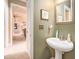Half bathroom featuring a pedestal sink and neutral color tones at 4710 Mcintosh Dr, Cumming, GA 30040