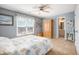 Comfortable bedroom with a ceiling fan, natural light, and ample space for furniture at 4710 Mcintosh Dr, Cumming, GA 30040