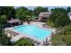 A large community pool with plenty of seating and a nearby clubhouse offers resort-style living at 4710 Mcintosh Dr, Cumming, GA 30040