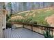 Outdoor deck with a serene view of the natural landscape and lush greenery at 4710 Mcintosh Dr, Cumming, GA 30040
