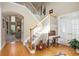 Bright foyer with hardwood floors, staircase, and french doors to let in natural light at 4710 Mcintosh Dr, Cumming, GA 30040