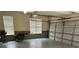 A clean and functional two car garage, perfect for parking and storage with natural light at 4710 Mcintosh Dr, Cumming, GA 30040