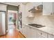 Efficient kitchen with stainless appliances, granite counters and tile backsplash at 4710 Mcintosh Dr, Cumming, GA 30040