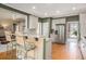 Charming kitchen features white cabinets, stainless steel appliances, and breakfast bar seating at 4710 Mcintosh Dr, Cumming, GA 30040