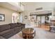 Spacious living room with a comfortable sofa and view to the dining area and kitchen at 4710 Mcintosh Dr, Cumming, GA 30040