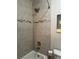 The full bathroom features a shower and tub combination with tiled walls and a shower head at 4710 Mcintosh Dr, Cumming, GA 30040