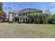 Beautiful back exterior with a patio and lush landscaping at 2510 Bent Creek Way, Cumming, GA 30041