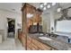 Bathroom boasting custom cabinetry, granite counters, large mirror and shower at 2510 Bent Creek Way, Cumming, GA 30041