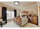 Cozy bedroom with decorative wooden bed frame, natural light and vintage furnishings at 2510 Bent Creek Way, Cumming, GA 30041
