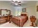 Cozy bedroom featuring a metal bed frame, dresser, and a ceiling fan for added comfort at 2510 Bent Creek Way, Cumming, GA 30041