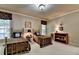 Comfortable bedroom with two twin beds, neutral walls, and carpeted floors at 2510 Bent Creek Way, Cumming, GA 30041