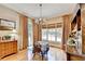 Sunny dining room with hardwood floors, a chandelier, large windows, and neutral walls at 2510 Bent Creek Way, Cumming, GA 30041
