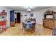Charming dining area with a round table, wooden chairs, and a vintage-style popcorn machine at 2510 Bent Creek Way, Cumming, GA 30041