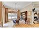 Bright dining room features hardwood floors, a chandelier, large windows, and an antique hutch at 2510 Bent Creek Way, Cumming, GA 30041