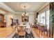 Elegant dining room featuring hardwood floors, a chandelier, and large windows at 2510 Bent Creek Way, Cumming, GA 30041