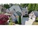 Stately brick home boasts a three-car garage, mature landscaping, and architectural details at 2510 Bent Creek Way, Cumming, GA 30041