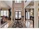 Grand foyer with soaring ceilings, hardwood floors, and elegant architectural details at 2510 Bent Creek Way, Cumming, GA 30041