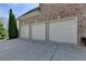 Three-car garage with ample parking space on a concrete driveway at 2510 Bent Creek Way, Cumming, GA 30041
