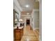 Elegant hallway with hardwood floors, crown molding, and natural light at 2510 Bent Creek Way, Cumming, GA 30041