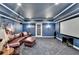 Home theater featuring surround sound, a projector and a spacious seating area at 2510 Bent Creek Way, Cumming, GA 30041