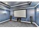 Home theater featuring surround sound, projector screen and a comfortable seating area at 2510 Bent Creek Way, Cumming, GA 30041