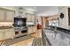 Well-appointed kitchen offering stainless steel appliances, granite countertops, and custom backsplash details at 2510 Bent Creek Way, Cumming, GA 30041