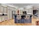 Gourmet kitchen featuring a center island with bar seating, stainless steel appliances, and custom cabinetry at 2510 Bent Creek Way, Cumming, GA 30041