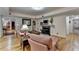 Inviting living room featuring hardwood floors and a cozy fireplace and an open layout at 2510 Bent Creek Way, Cumming, GA 30041