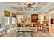 Bright living area showcasing a coffered ceiling, large windows, hardwood floors, and sophisticated decor at 2510 Bent Creek Way, Cumming, GA 30041