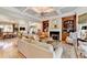 Elegant living room boasts coffered ceilings, hardwood floors, built-in bookshelves, and a cozy fireplace at 2510 Bent Creek Way, Cumming, GA 30041