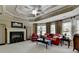Bright living room with a fireplace, hardwood furniture, and many windows at 2510 Bent Creek Way, Cumming, GA 30041