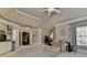 Large main bedroom with sitting area, built-in shelves, and ample natural light at 2510 Bent Creek Way, Cumming, GA 30041