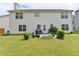 Spacious backyard with a well-manicured lawn, patio, and plenty of space for entertaining at 3285 Watson Gate Rd, Loganville, GA 30052