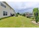 Large backyard with lush green grass, tasteful landscaping, and privacy fence at 3285 Watson Gate Rd, Loganville, GA 30052