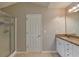 Updated bathroom features a glass shower and granite countertops with double sinks at 3285 Watson Gate Rd, Loganville, GA 30052