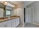 Updated bathroom with double sinks, granite countertops, and vanity at 3285 Watson Gate Rd, Loganville, GA 30052
